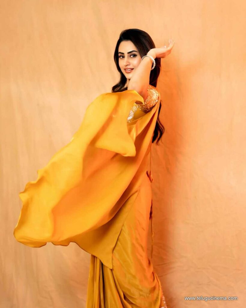 Archana Iyer in a yellow Saree
