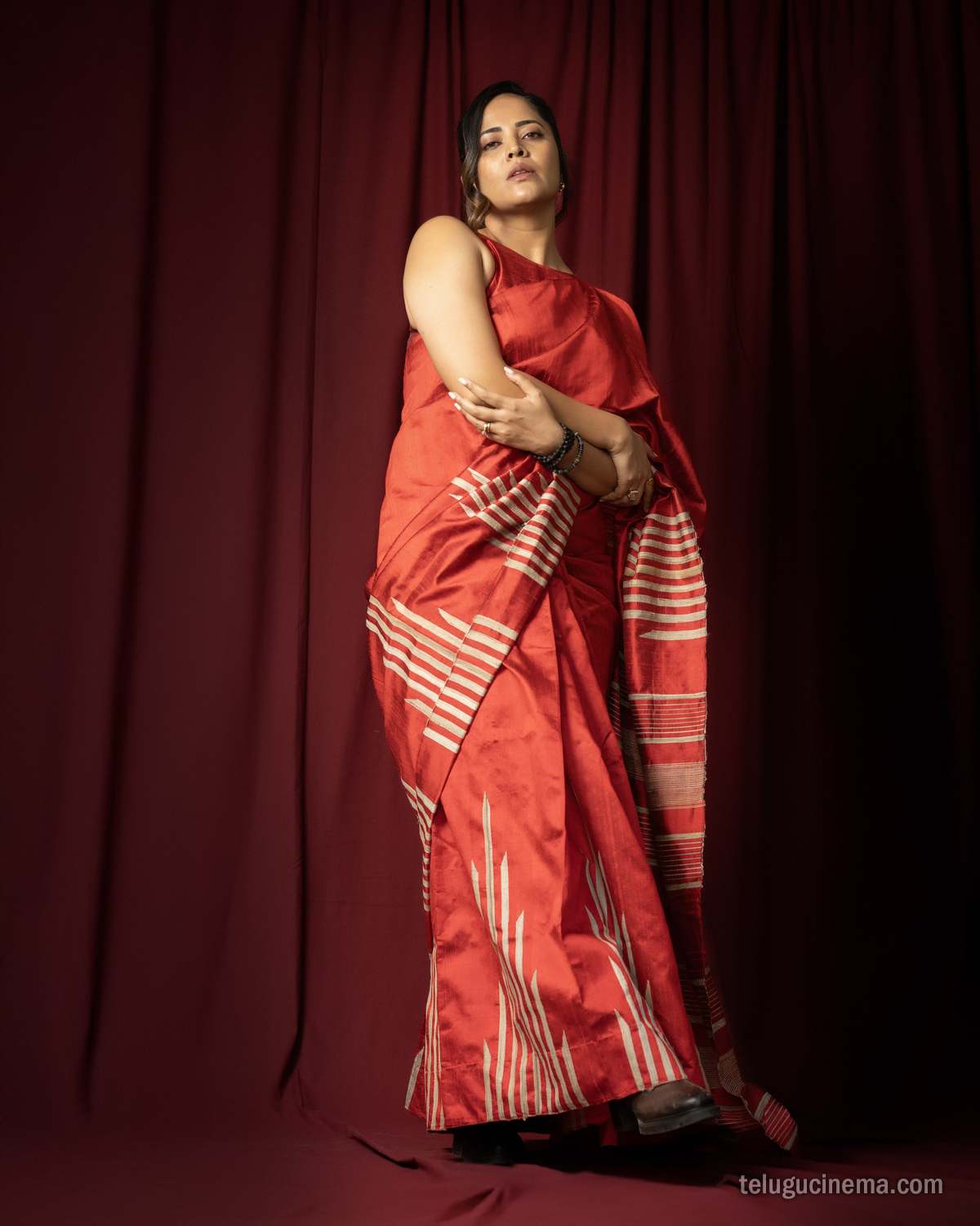 Anasuya Bharadwaj exudes elegance in a striking red saree