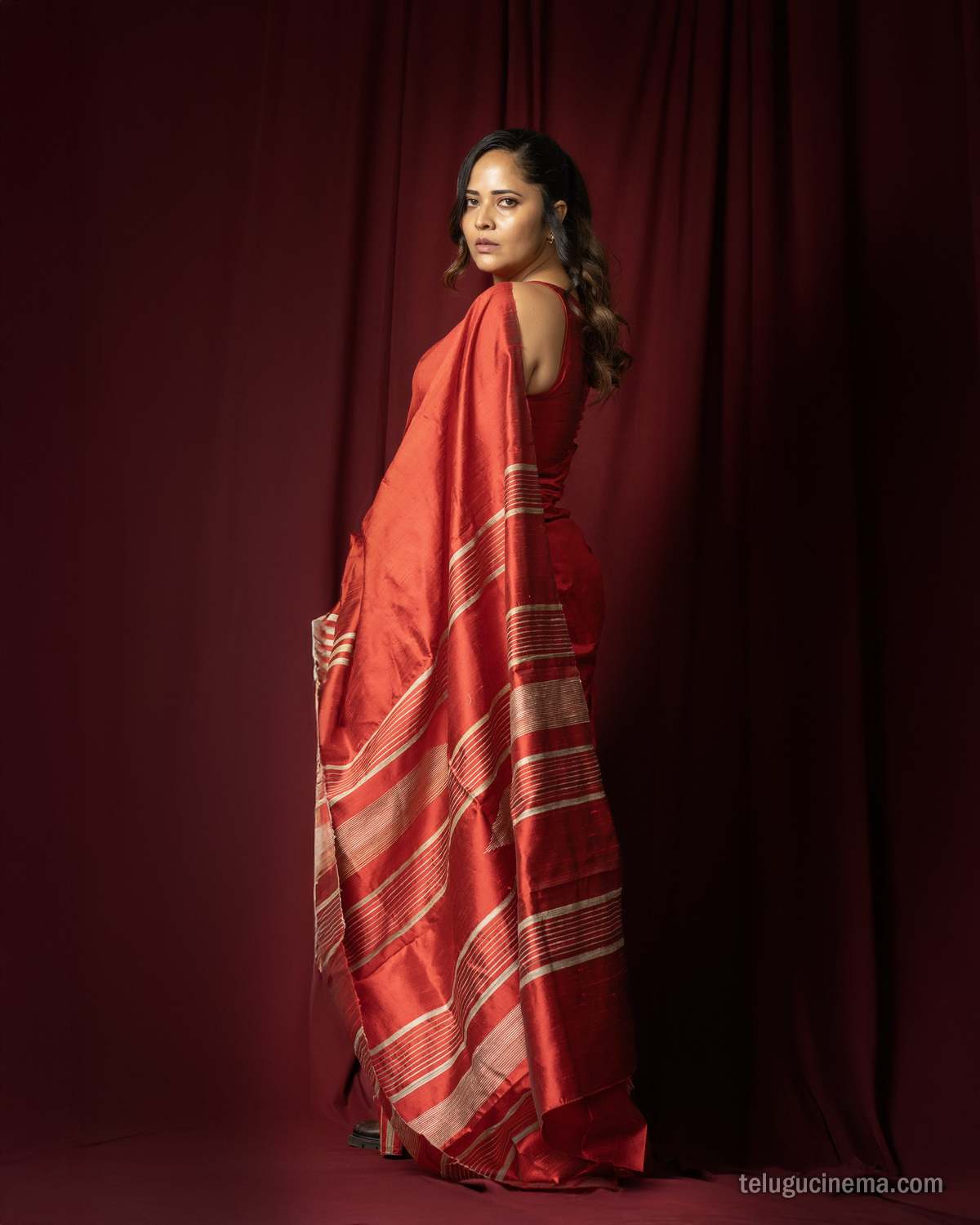 Anasuya Bharadwaj exudes elegance in a striking red saree