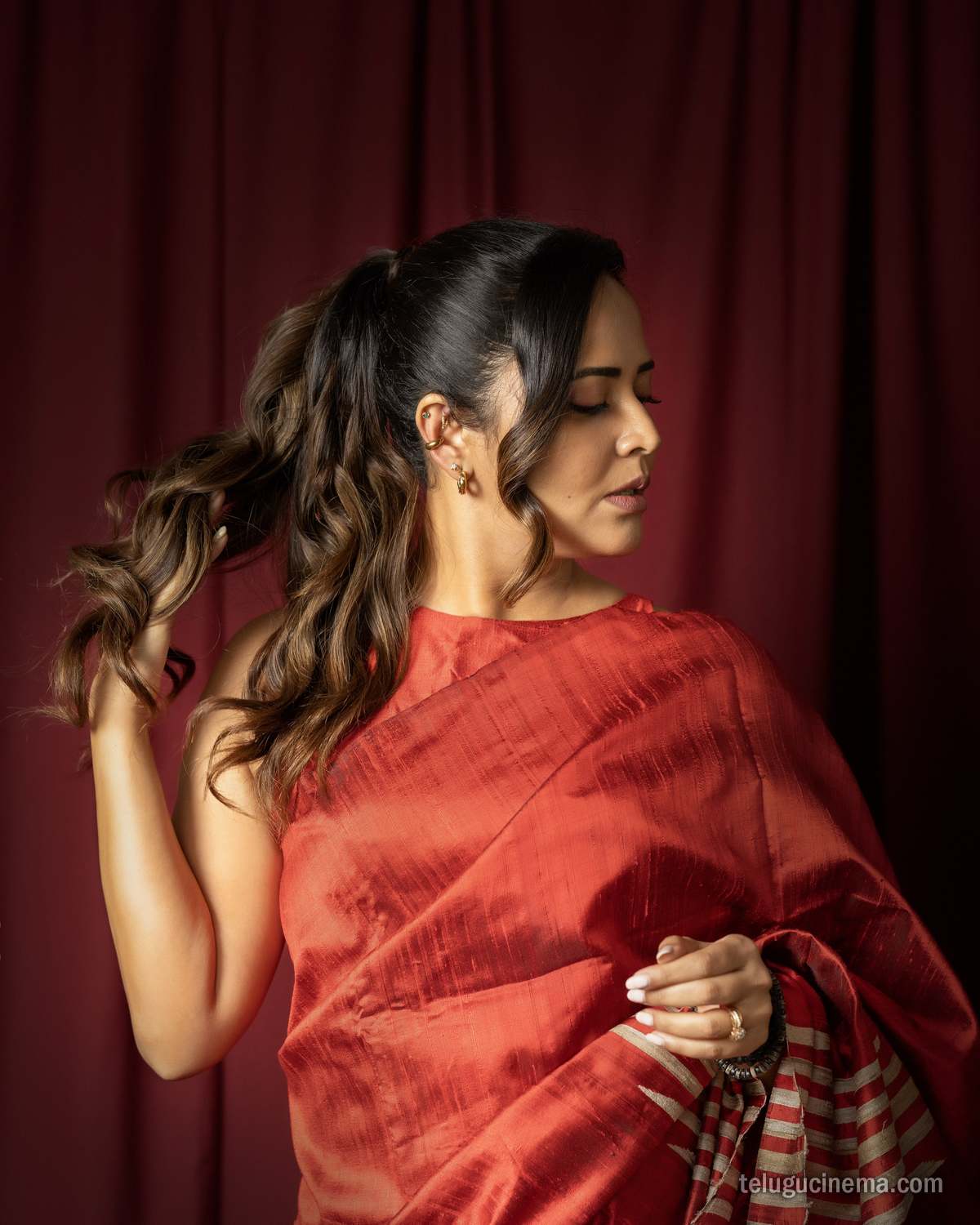 Anasuya Bharadwaj exudes elegance in a striking red saree