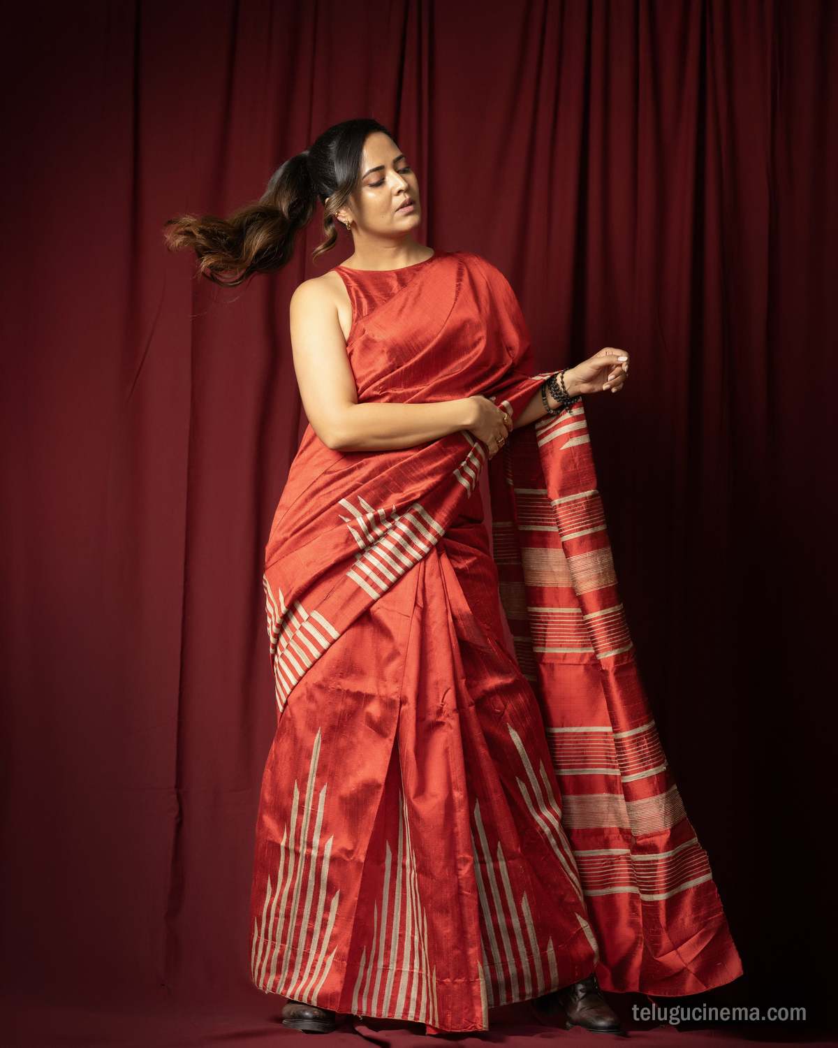 Anasuya Bharadwaj exudes elegance in a striking red saree