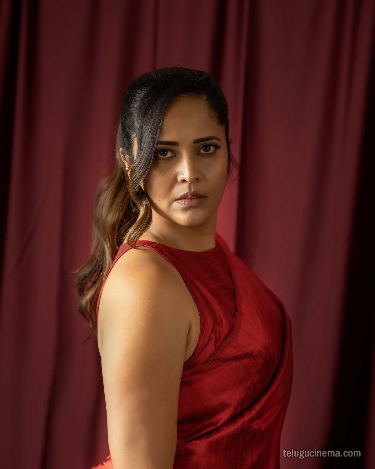 Anasuya Bharadwaj exudes elegance in a striking red saree