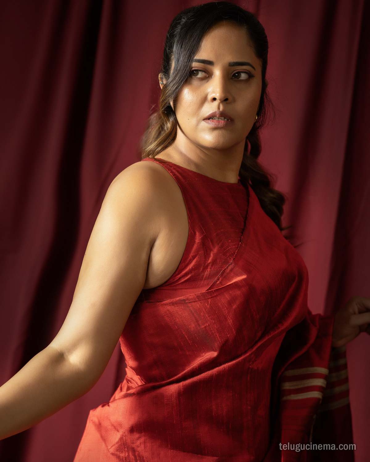 Anasuya Bharadwaj exudes elegance in a striking red saree