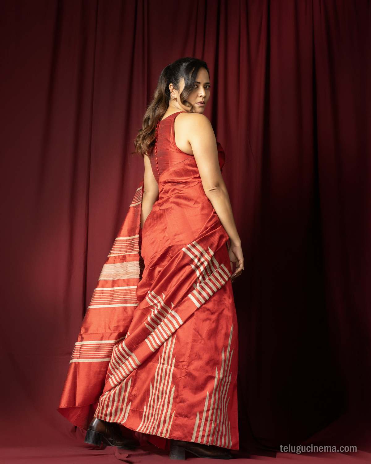 Anasuya Bharadwaj exudes elegance in a striking red saree