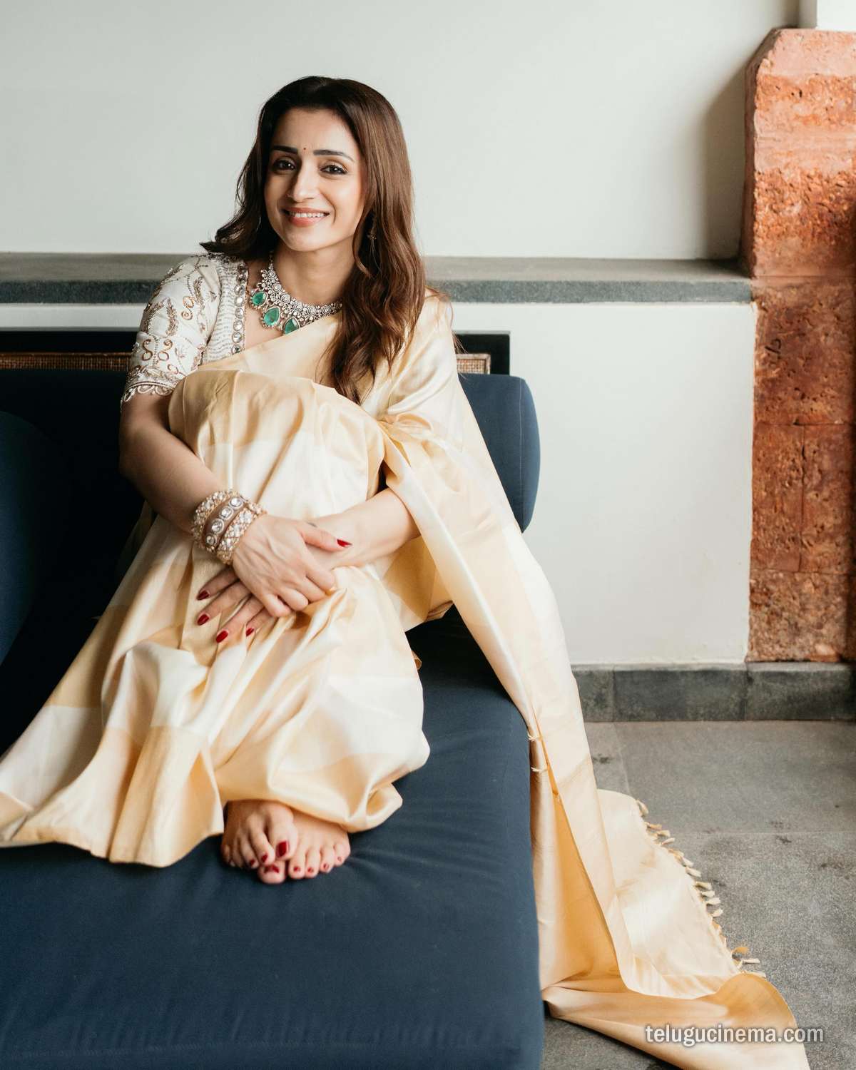 Trisha Krishnan looks graceful in a classic cream saree