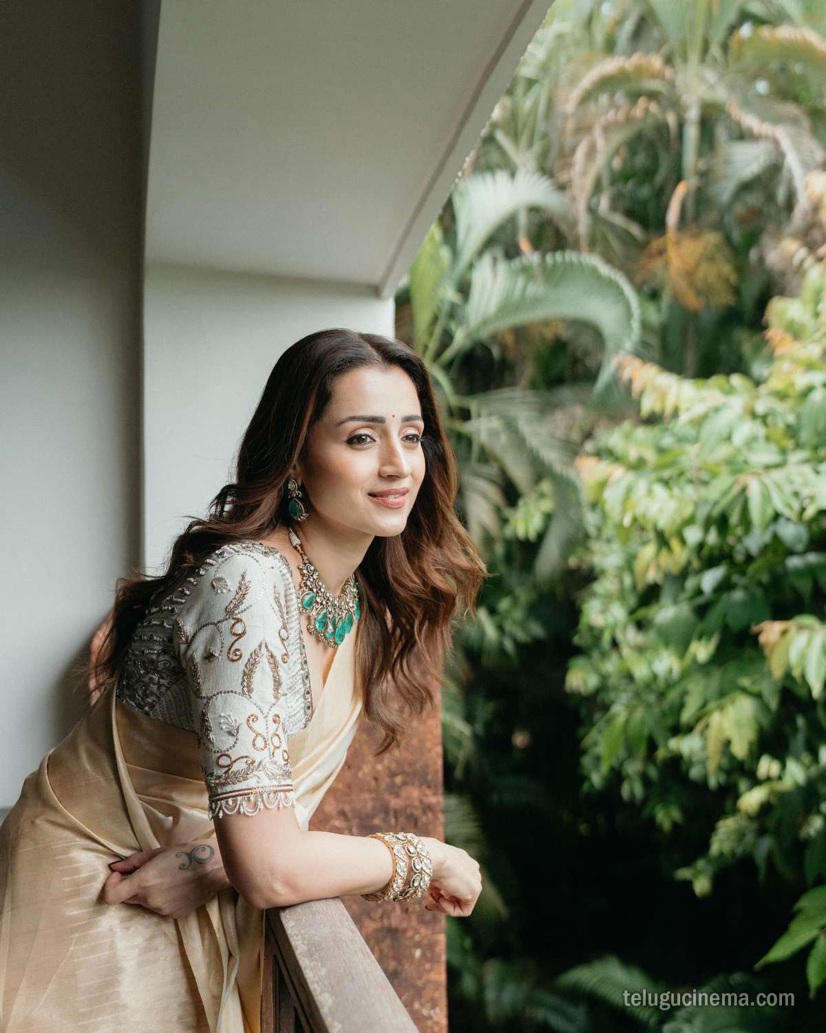 Trisha Krishnan looks graceful in a classic cream saree